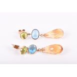 A pair of 14ct yellow gold, peridot, topaz, and citrine drop earrings each with a cabochon