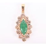 A yellow metal, diamond, and emerald pendant centred with a marquise-shaped emerald, approximately