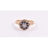 An 18ct yellow gold, diamond, and sapphire cluster ring with textured shoulders, size L 1/2, 4