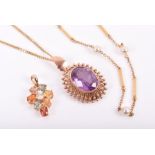 A rose gold and gemstone pendant set with a purple / green stone (possibly Alexandrite or