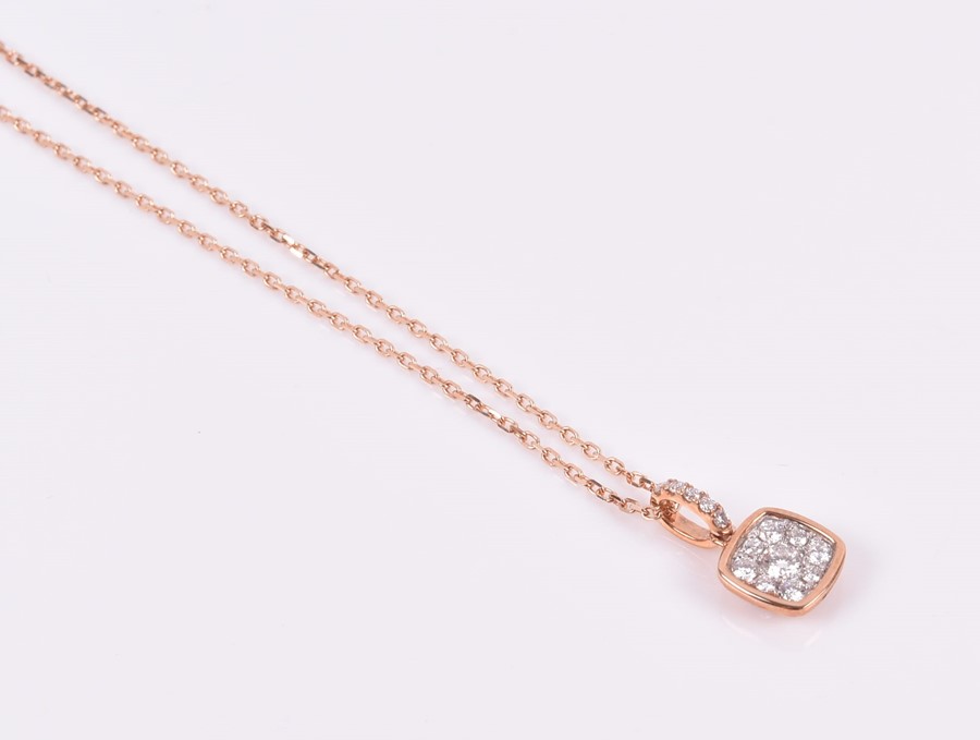 An 18ct rose gold and diamond pendant the squared mount pave-set with round-cut diamonds,