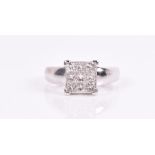 An 18ct white gold and diamond ring calibre-set with a square of nine square-cut diamonds, of