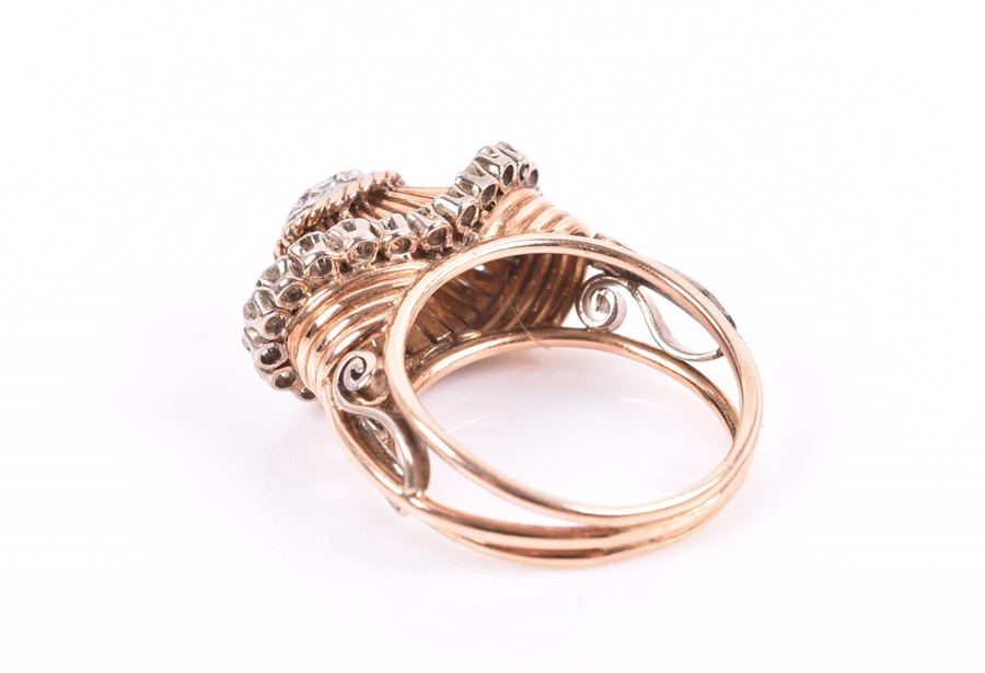 An unusual rose gold and diamond ring with ornate domed mount inset with old-cut diamonds, the mount - Image 2 of 2