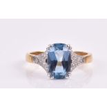 An 18ct yellow gold, diamond, and aquamarine ring set with a faceted rectangular-cut aquamarine of