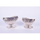 A graduated pair of William IV silver sugar baskets London, 1831 and 1832, each with canted