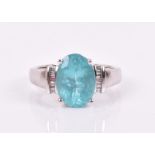 A 14ct white gold, diamond, and apatite ring set with a mixed oval-cut apatite of approximately 3.90