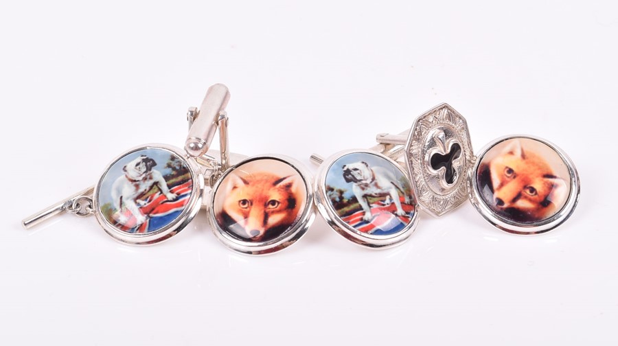 A pair of novelty silver cuff links depicting a British bulldog standing in a Union flag, together
