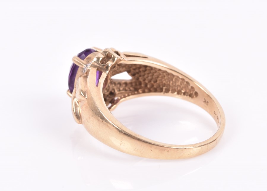 A 9ct yellow gold, diamond, and amethyst ring set with a mixed oval-cut amethyst with openwork - Image 2 of 3