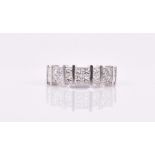 An 18ct white gold and diamond ring bar set with square-cut diamonds in twos and fours,