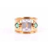 Theo Fennell. An 18ct yellow gold, emerald, and cubic zirconia ring the wide band centred with an