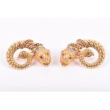 Ilias Lalaounis. A pair of 18ct yellow gold, diamond and ruby ear clips the lion-head terminals with