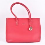 Furla tote bag in pink the textured leather body features a gold tone Furla logo along with a