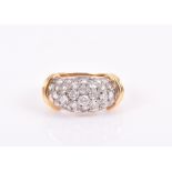 Kutchinsky. A yellow metal and diamond ring the curved bombe mount pave set with round-cut diamonds,