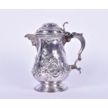 A large Victorian silver tankard with hinged cover London, 1868 by Robert Harper, with scrolling,