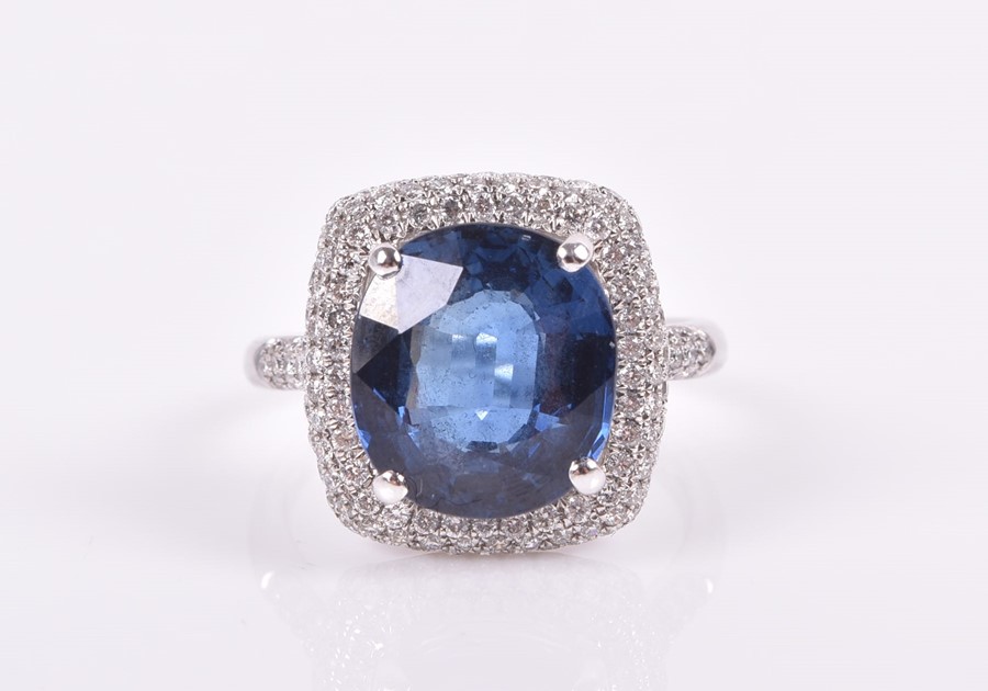 An 18ct white gold, diamond, and sapphire ring set with a cushion-cut blue sapphire of approximately - Image 3 of 3