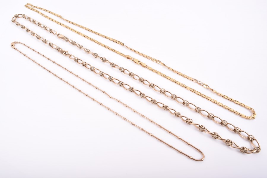 A group of three 9ct yellow gold necklaces of beaded, rope twist and curb link designs. 46 grams. (