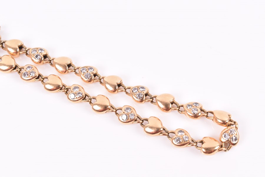 Cartier. An 18ct yellow gold and diamond bracelet with heart-shaped links, each set with three round - Image 2 of 4