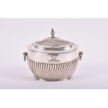 A late Victorian silver tea caddy London 1896, by Charles Boyton, of oval form with half fluted body