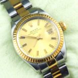 Damenarmbanduhr "ROLEX Oyster Perpetual Date". Rundes Gehäuse und Armband Edelstahl mit 18 kt. GG.