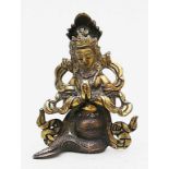 Buddha als Naga (Schlangengott).Partiell feuervergoldete Bronze, 216 g. Tibet, 19. Jh. H. 9 cm.