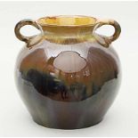 Vase.Graues Steinzeug mit verschiedenfarbiger Laufglasur, überwiegend in Beige-, Braun- und