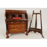 A miniature, partially mahogany, cylinder desk and a easel, 19th century Deels mahonie rolbureau