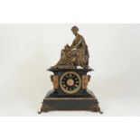 a marble and bronze mantle clock with a sculpture of a Greek lady, late 19th century