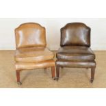 A set of two minature chairs with brow leather upholstery