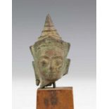 Thailand, two bronze Ayuthia style Buddha heads, ca. 1600 with engraved headdress. h. 6,5 and 4,5