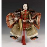 Japan, Samurai pop 'musha ningyo', met gofun hoofd h. ca. 40 cm. [1]