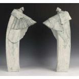 Twee keramiek sculpturen, ca. 1970; Figuren in wikkels (één beschadigd) h. 48 cm. [2]