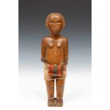 Central Sulawesi, Toraja, diminutive figure, tau tau,dressed in a loin cloth and details in black.