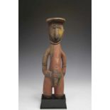 PNG, Maprik, standing male figure,flattened hair dress, traces of polychrome. Lower legs missing. h.