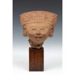 Mexico, Vera Cruz, 500-800,earthen ware buste of smiling figure. h. 16 cm. [1]