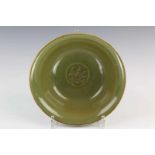 China, celadon komde buitenrand met relief diam. 19 cm. [1]