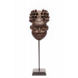 Cameroon Grassland, helmet maskwith elongated head with fine carved head dress with typical carved