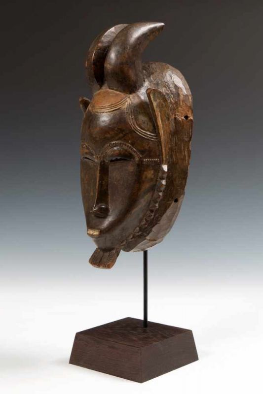 Ivory Coast, Baule, face mask, kpan prefemale face mask with rams horns, curved ears, rows of carved