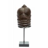 Sierra Leone, Mende, helmet mask, sowei.hair dress in four bulbous braids, two conical tops and