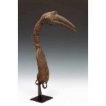 Nigeria, hunters maskshaped as a birds head. Partly covered in leather. h. 23 cm. [1]
