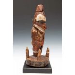 PNG, Lower Sepik, suspension hook,standing male figure painted in white, red and black pigments,