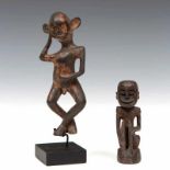 East Borneo, dancing mythological figure as amuletHerewith an amulet of seated figure. h. 14,5 and