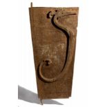 Borneo, Sarawak, Iban Dayak, hardwood tapered door panel,carved with a singular raised figure of a