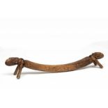 PNG, Sentani, wooden neck restwith two carved ancestor heads and bamboo rests. With remains of black