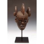 Nigeria, Idoma, helmet mask,with three vertical crests and bulbous horizontal hairdo surmounted by a