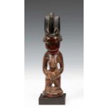 Nigeria, Yoruba, Egba, female Ibejiwith shining patina. h. 25,5 cm. [1]