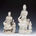 China, twee blanc-de-Chine Guanyins, 19e eeuw;Gezeten op een rots, met ruyi-scepter in de hand en
