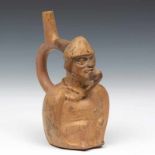 Peru, Moche, 100-750, earthenware stirrup vessel-flute,in the form of a seated figure with a fruit