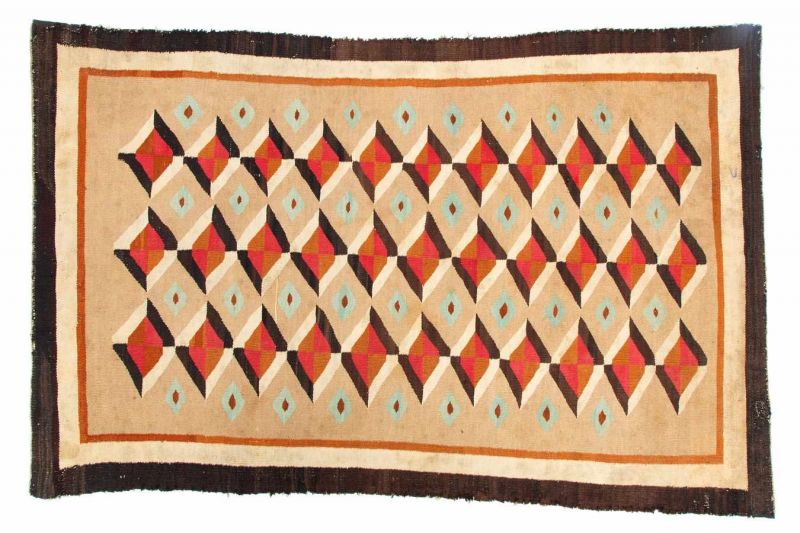 Navaho Indians, wool rug;softly woven in hand spun wool, in rhombic shapes and natural colours.