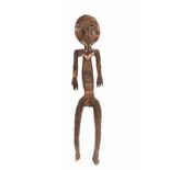 PNG, Papua Golf, spirit figure, bioma,with in low relief spiral eyes and geometrical patterns.