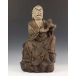 Korea, polychroom en gestoken houten sculptuur;Luohan, met kind op de arm. h. 52 cm. [1]
